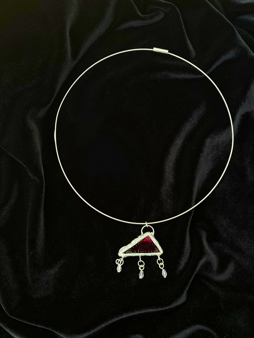 Translucent red engraved glass pendant