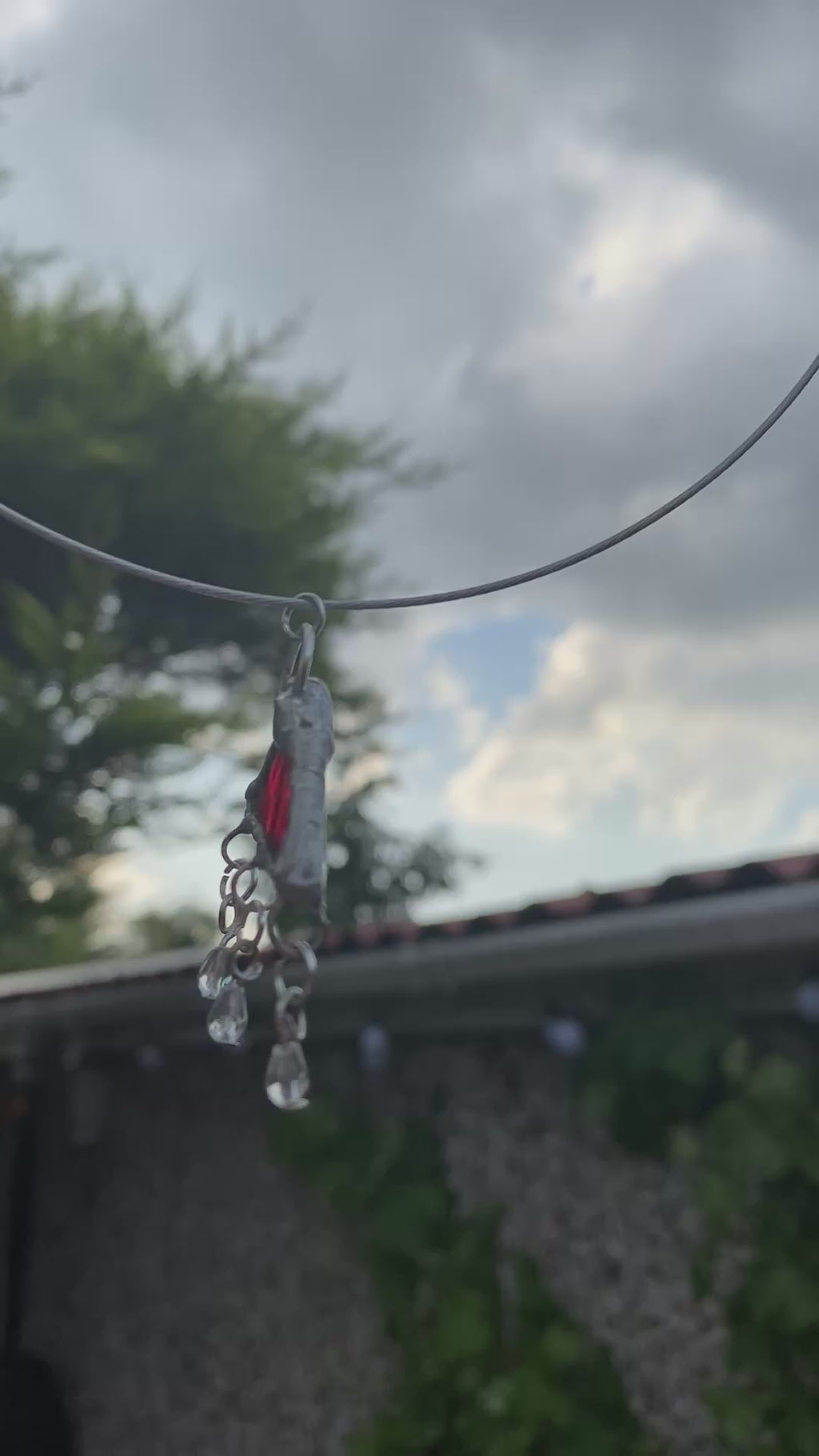 Translucent red engraved glass pendant