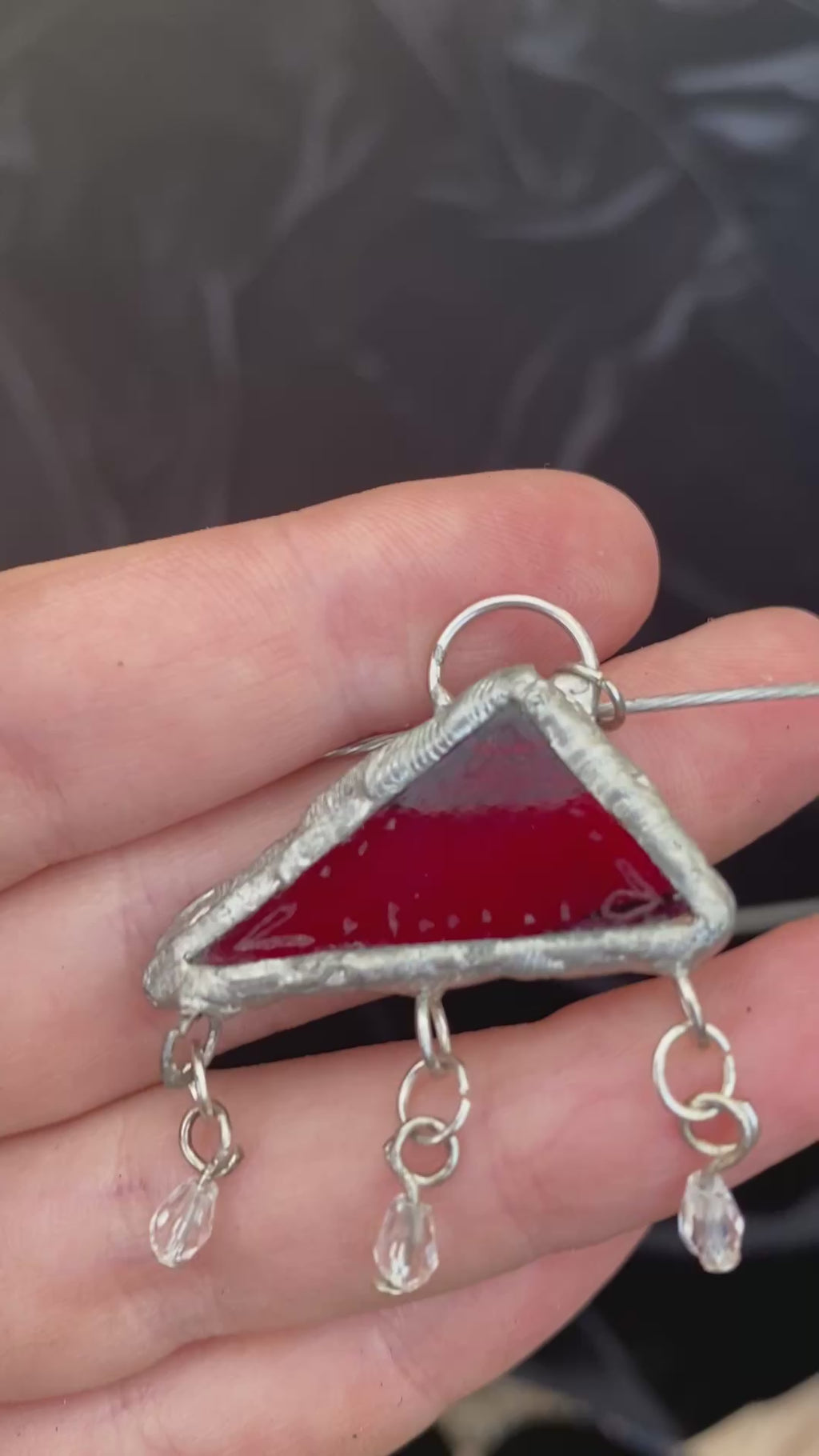 Translucent red engraved glass pendant